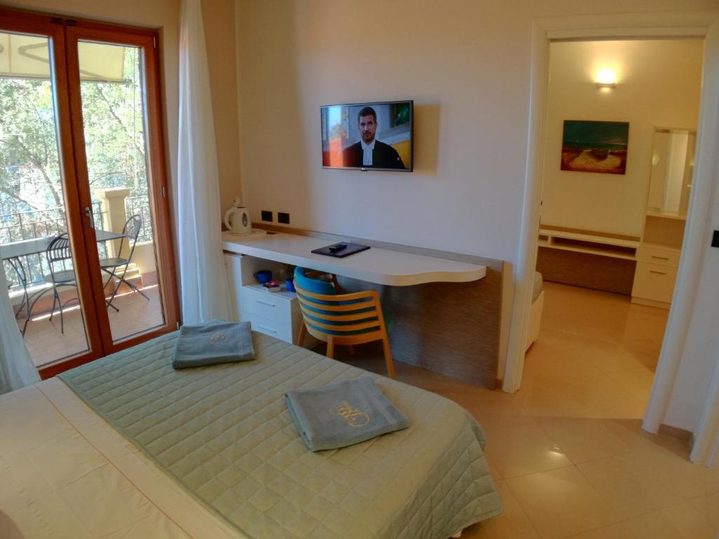 Postel nebo postele na pokoji v ubytování Hotel Residence Piccolo