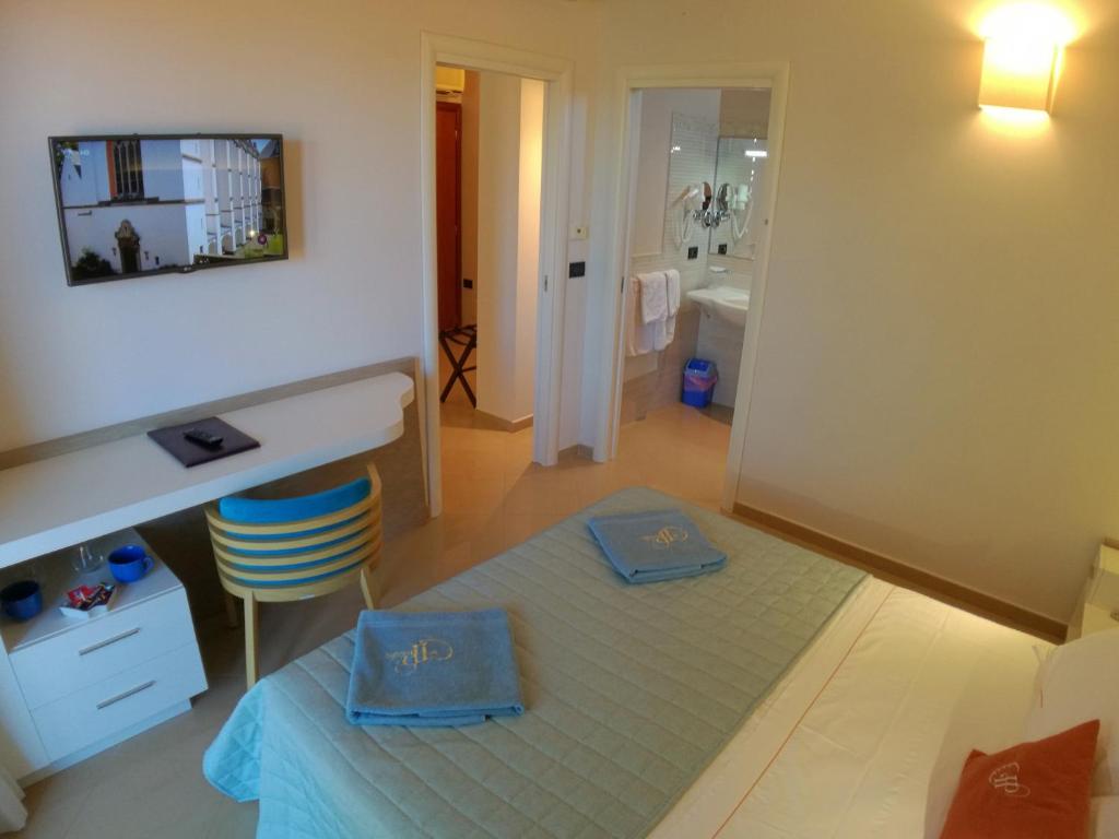 Postel nebo postele na pokoji v ubytování Hotel Residence Piccolo