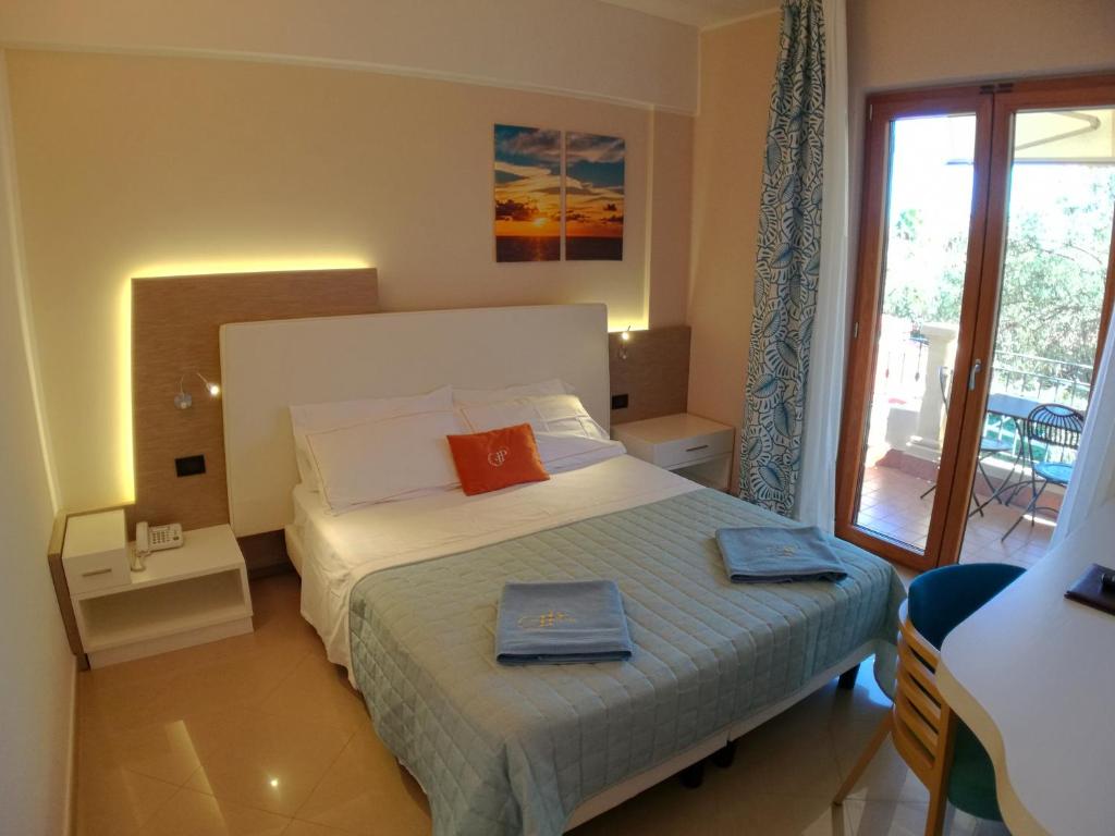 Postel nebo postele na pokoji v ubytování Hotel Residence Piccolo