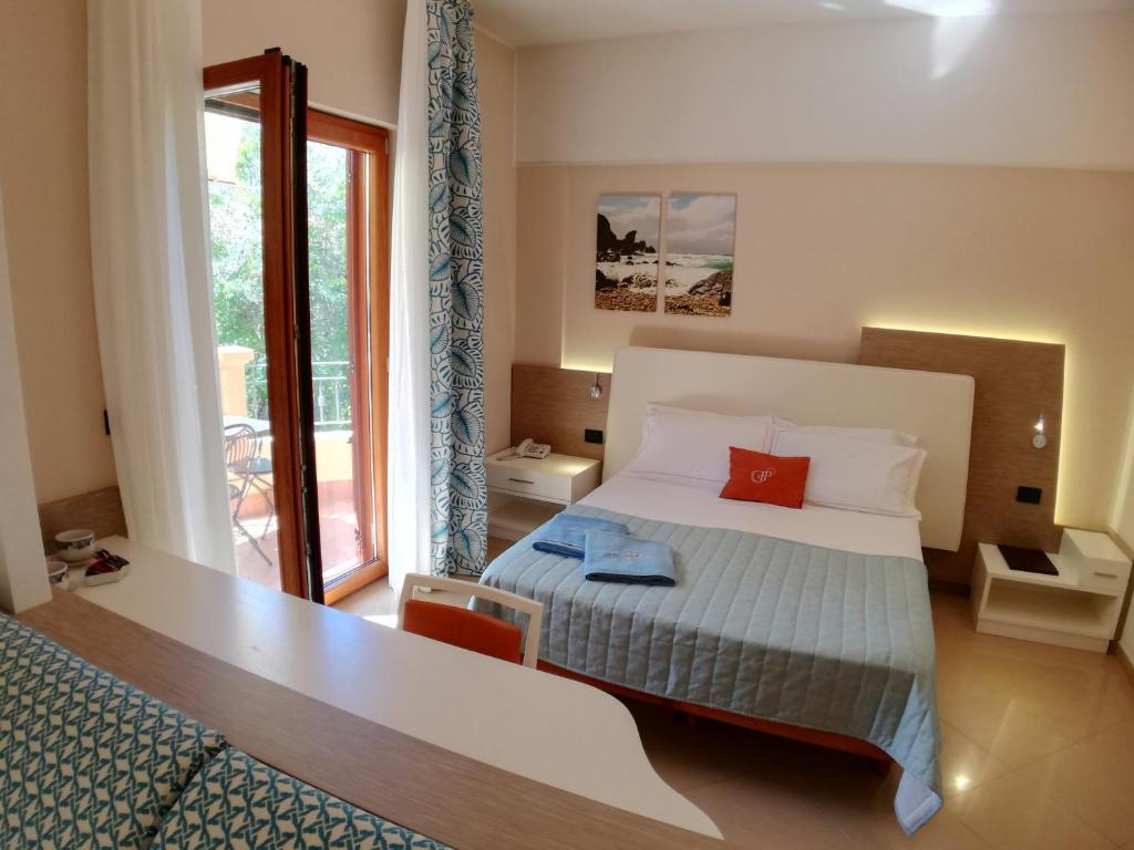 Postel nebo postele na pokoji v ubytování Hotel Residence Piccolo