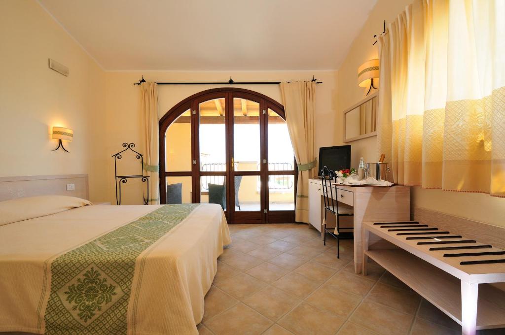 Postel nebo postele na pokoji v ubytování Hotel Baia Del Porto