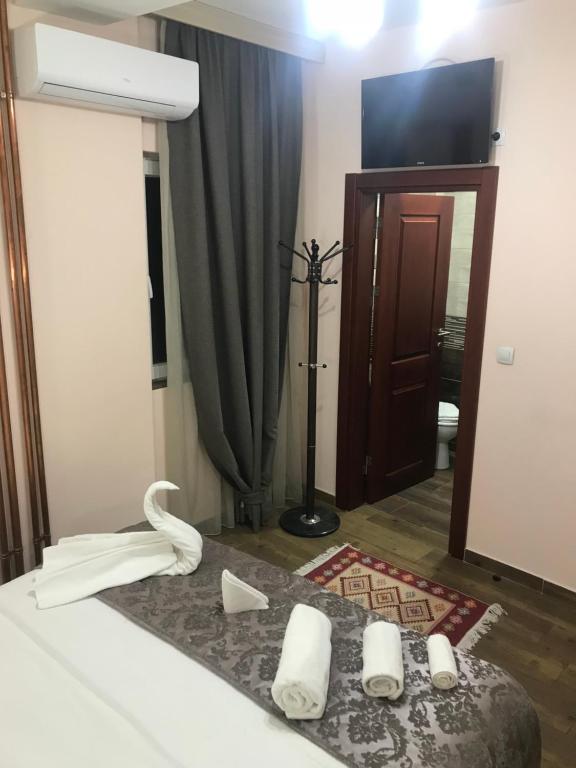 Postel nebo postele na pokoji v ubytování Prenociste DM5