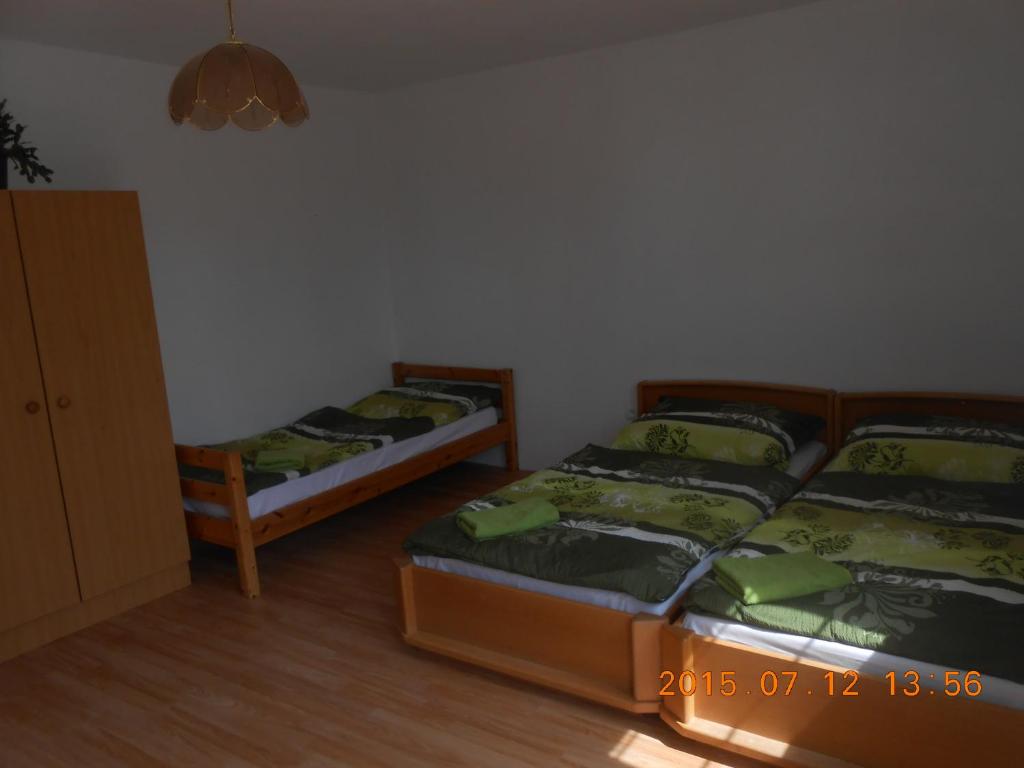 Postel nebo postele na pokoji v ubytování Apartmán Kamila