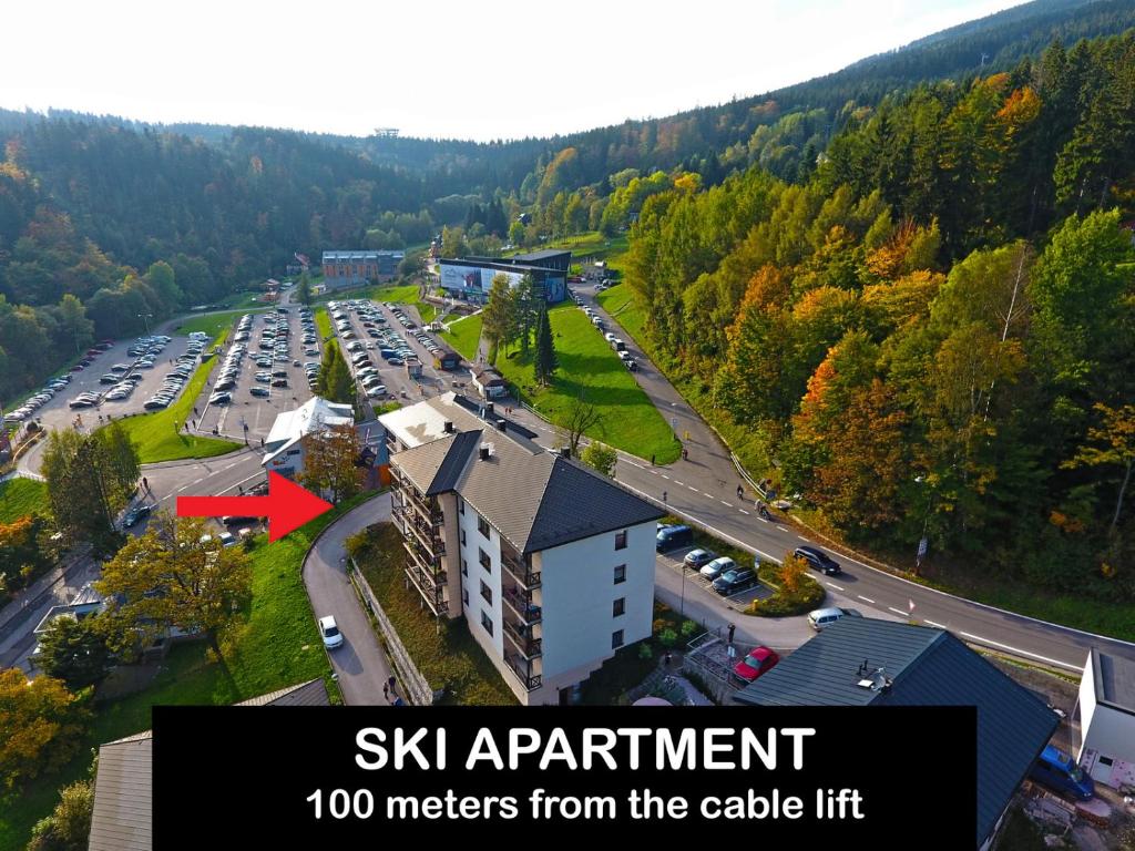 an aerial view of a parking lot with a building at Ski Apartment in Janske Lazne