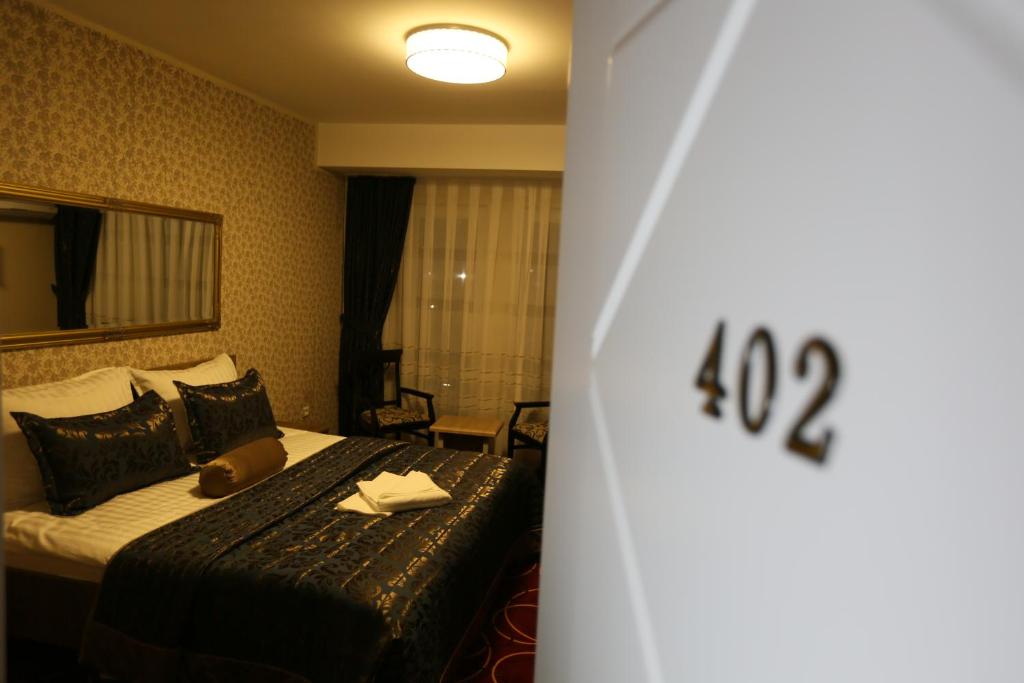 Postel nebo postele na pokoji v ubytování Hotel Pejton