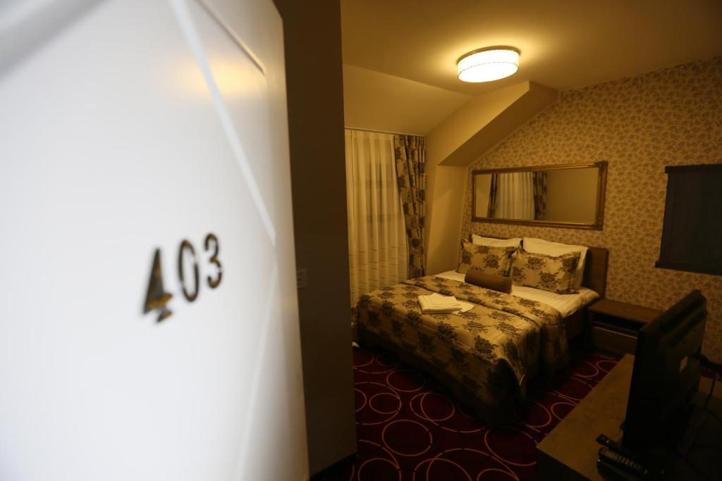 Postel nebo postele na pokoji v ubytování Hotel Pejton