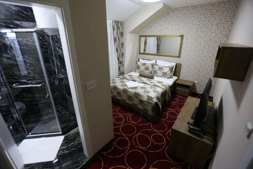 Postel nebo postele na pokoji v ubytování Hotel Pejton