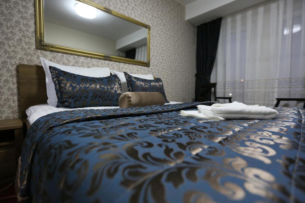 Postel nebo postele na pokoji v ubytování Hotel Pejton