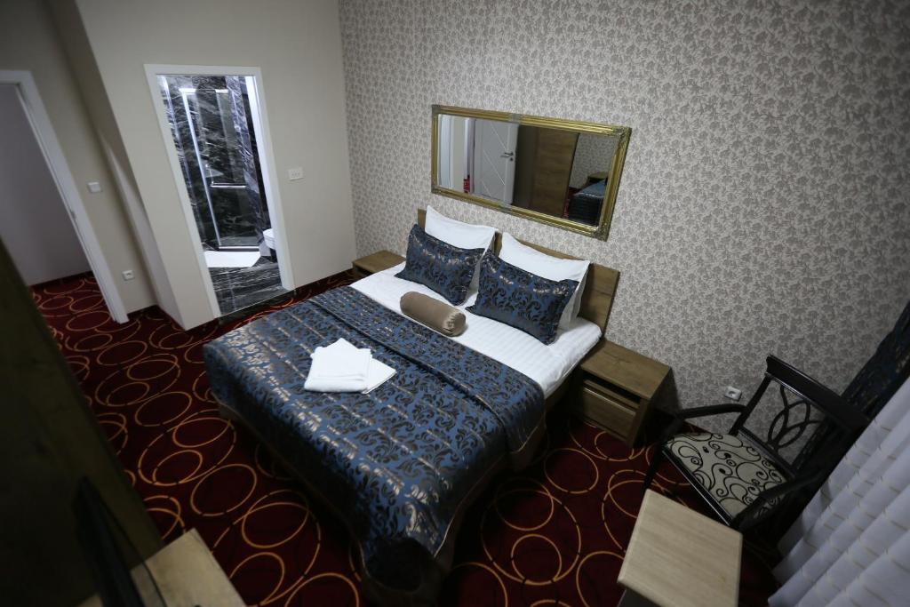 Postel nebo postele na pokoji v ubytování Hotel Pejton