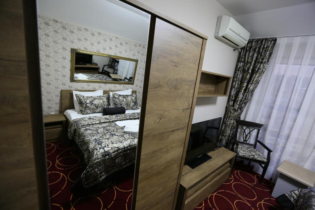 Postel nebo postele na pokoji v ubytování Hotel Pejton