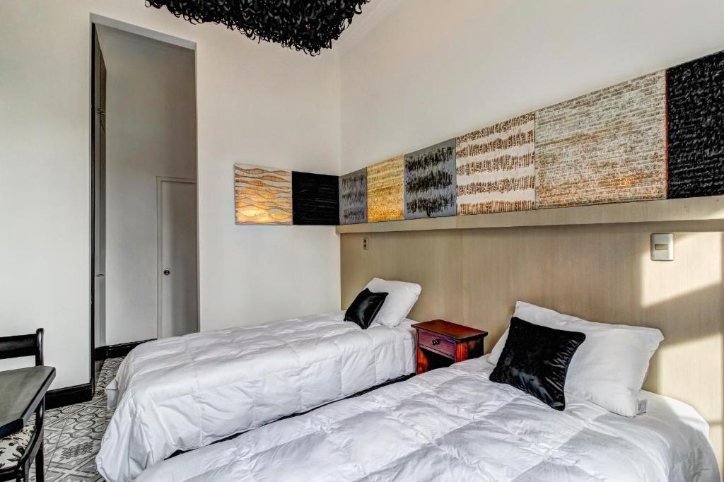 Postel nebo postele na pokoji v ubytování Casa Puente Hotel Boutique