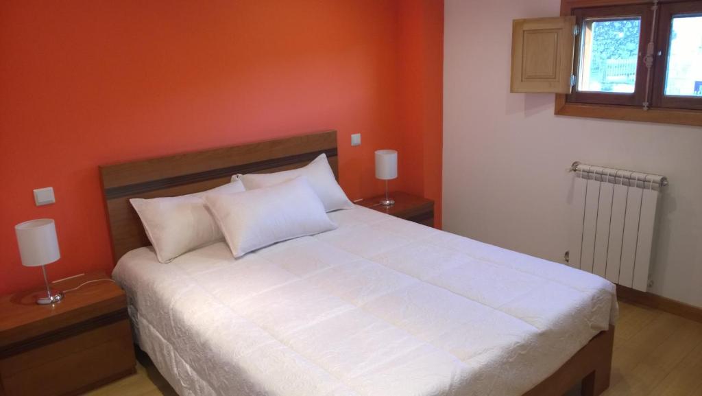 Postel nebo postele na pokoji v ubytování Casa das Neves