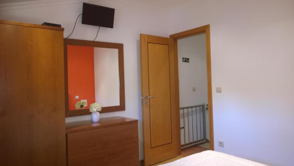 Postel nebo postele na pokoji v ubytování Casa das Neves