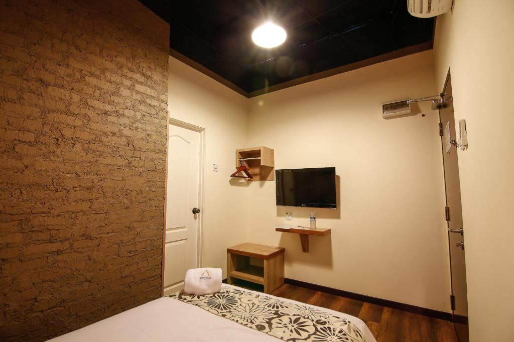 TV a/nebo společenská místnost v ubytování Art Cottage Hotel