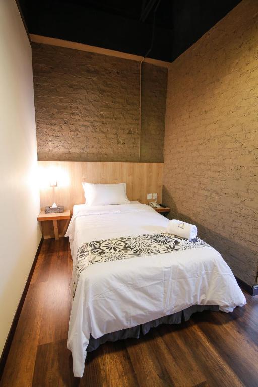 Postel nebo postele na pokoji v ubytování Art Cottage Hotel