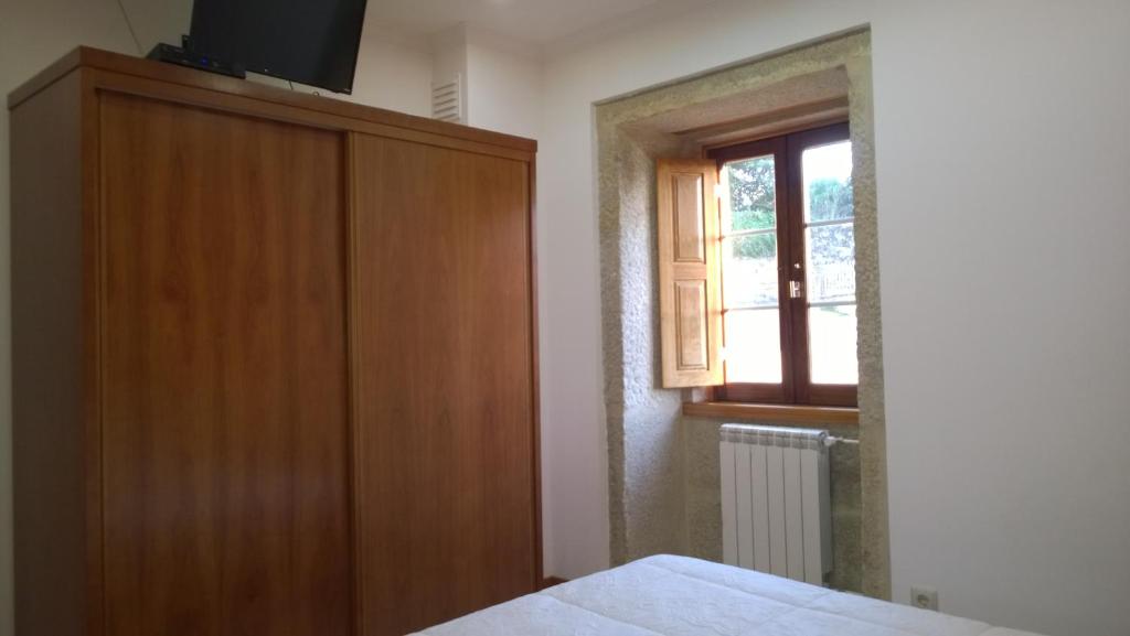 Postel nebo postele na pokoji v ubytování Casa das Neves