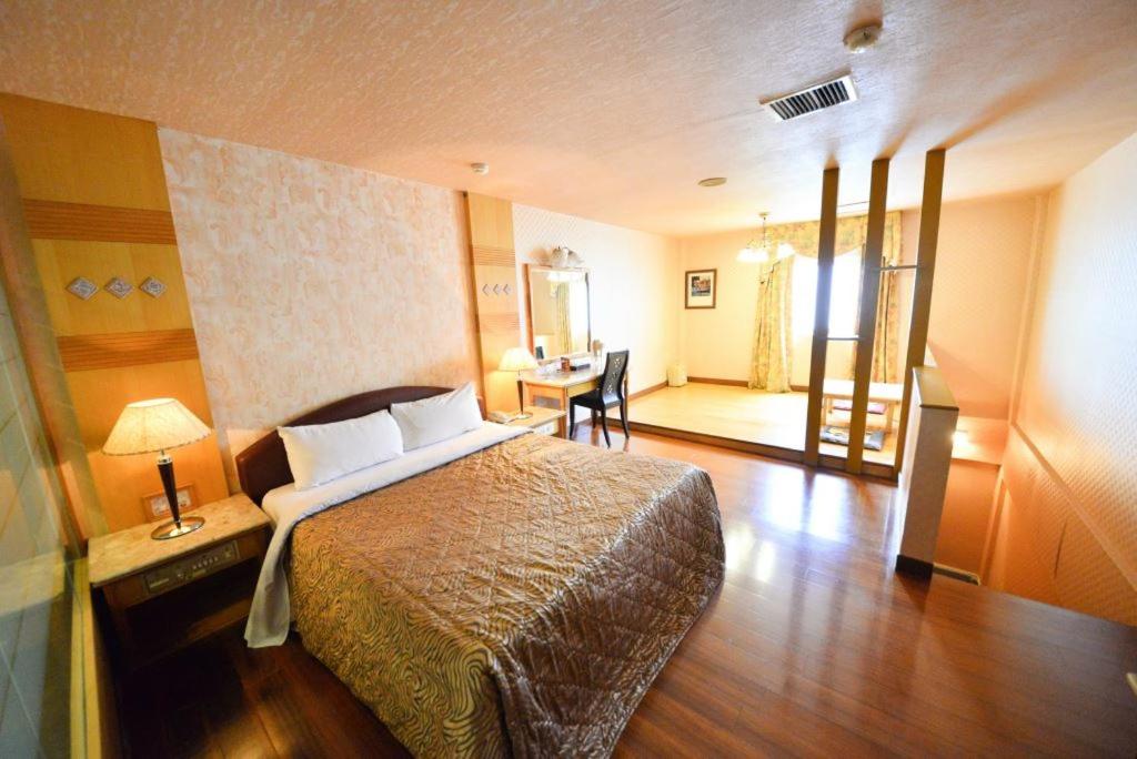 Postel nebo postele na pokoji v ubytování Paiwei Motel