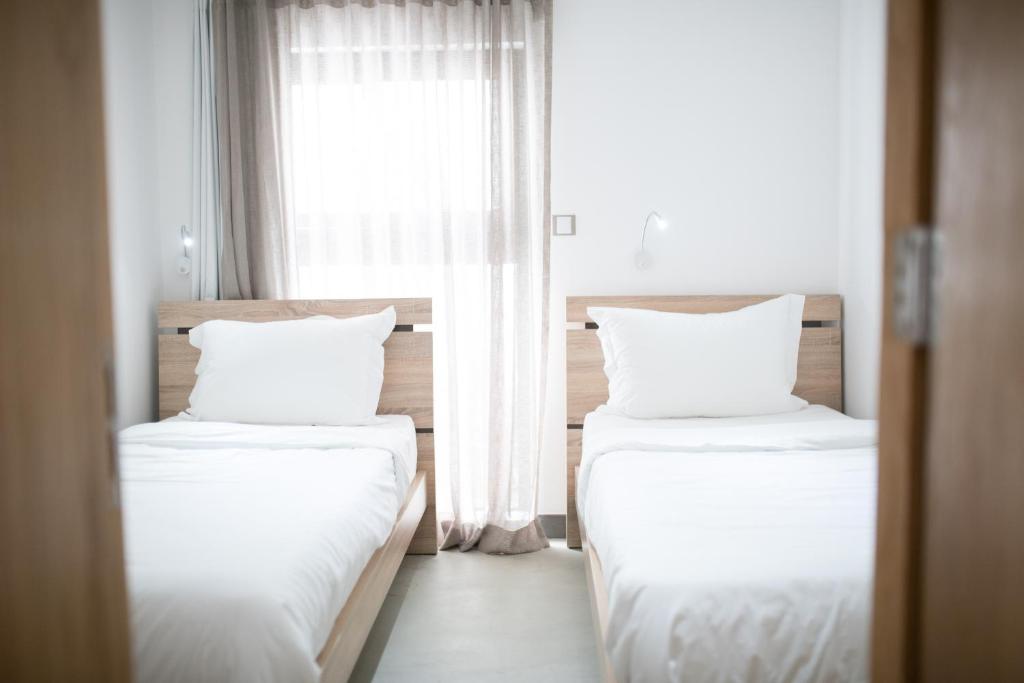Postel nebo postele na pokoji v ubytování Toparadis Guest House