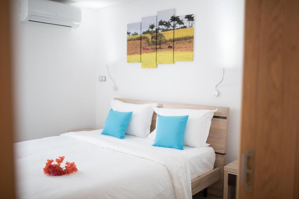 Postel nebo postele na pokoji v ubytování Toparadis Guest House