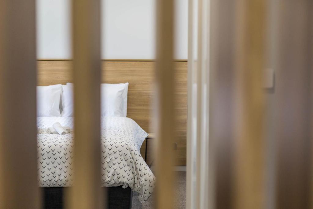 Postel nebo postele na pokoji v ubytování Civic Apartments