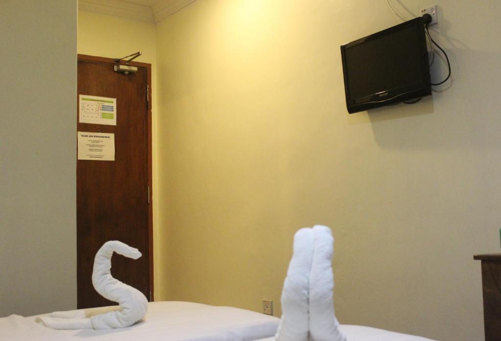 TV a/nebo společenská místnost v ubytování Alonto Hotel