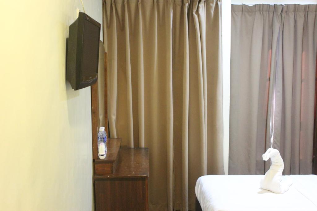 TV a/nebo společenská místnost v ubytování Alonto Hotel