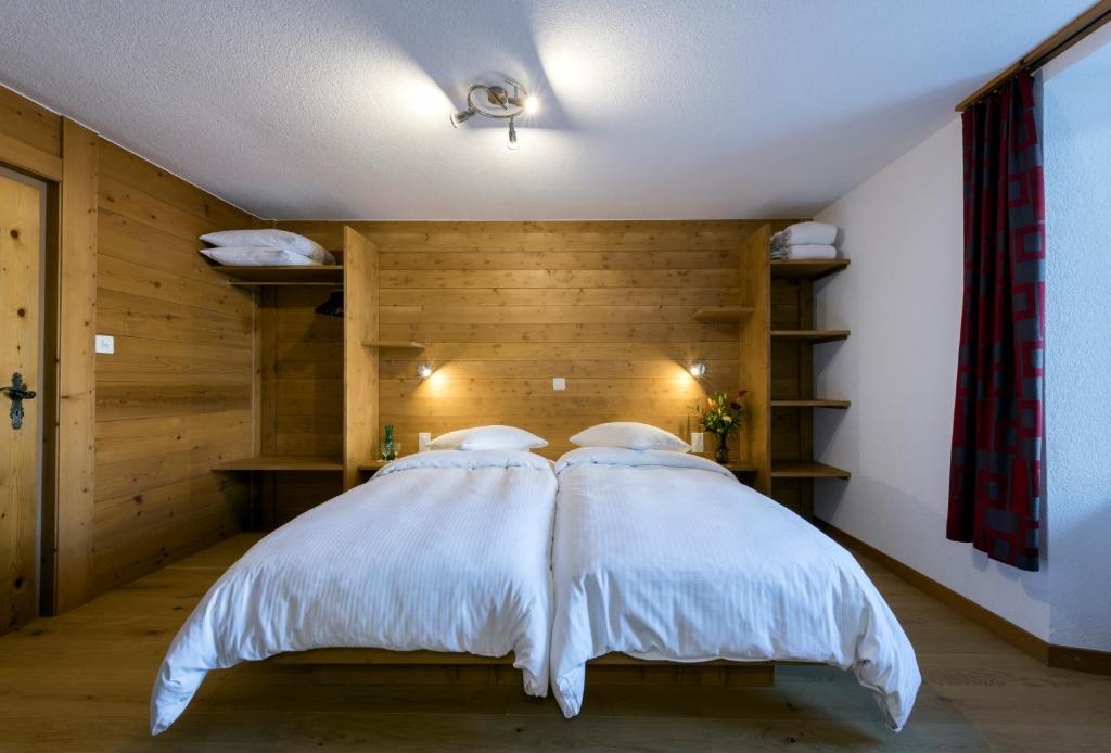 Postel nebo postele na pokoji v ubytování La Vallée Hôtel &Spa