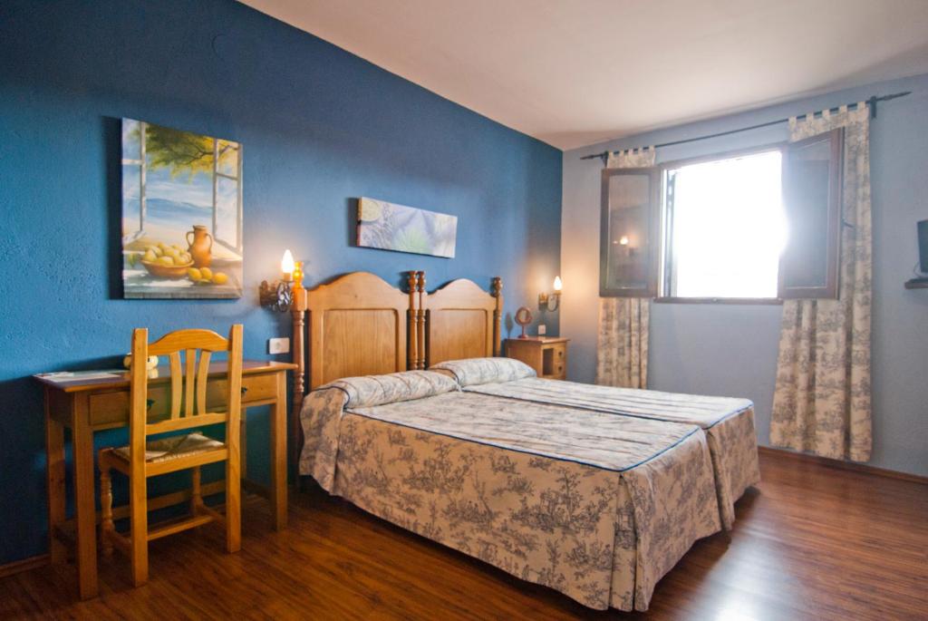 Postel nebo postele na pokoji v ubytování Hostatgeria Sant Jaume