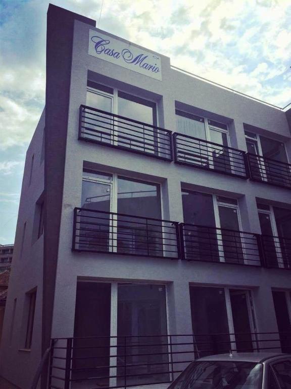 a building with balconies on the side of it at Casa Mario in Baile Felix