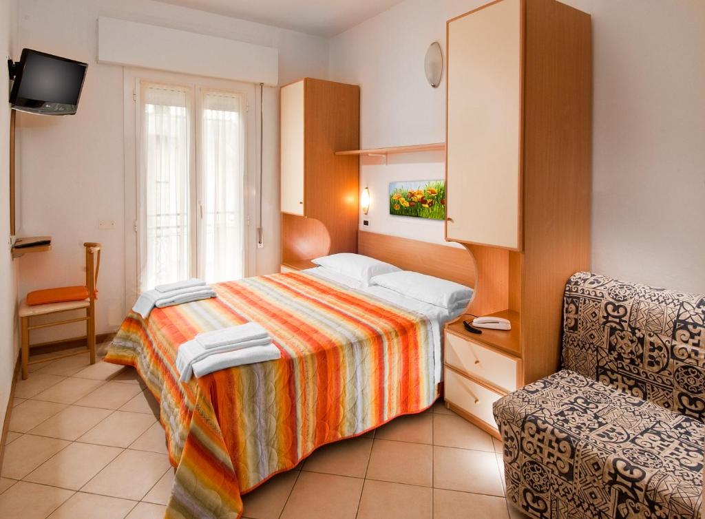 Postel nebo postele na pokoji v ubytování Hotel Adler