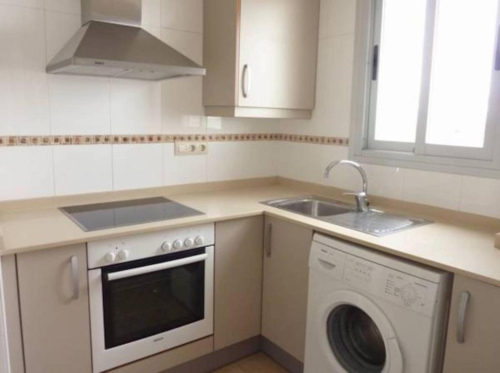Kuchyňa alebo kuchynka v ubytovaní Apartamentos Deluxe Pompeya 3