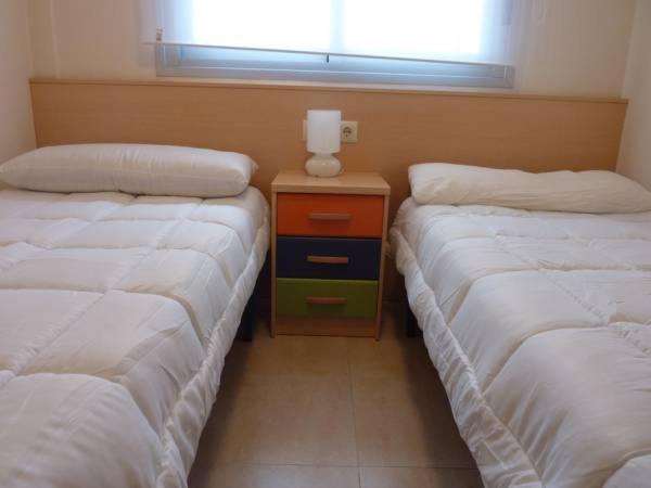 Posteľ alebo postele v izbe v ubytovaní Apartamentos Deluxe Pompeya 3