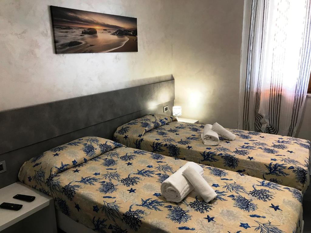 Postel nebo postele na pokoji v ubytování Hotel Village Eden