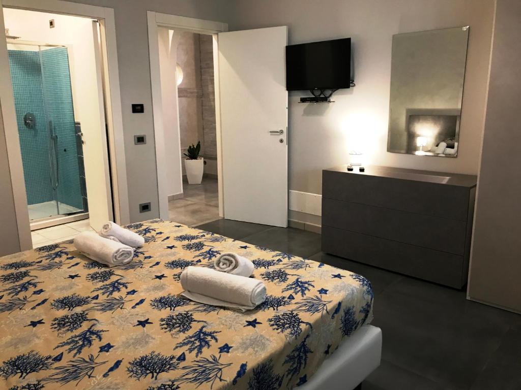 Postel nebo postele na pokoji v ubytování Hotel Village Eden