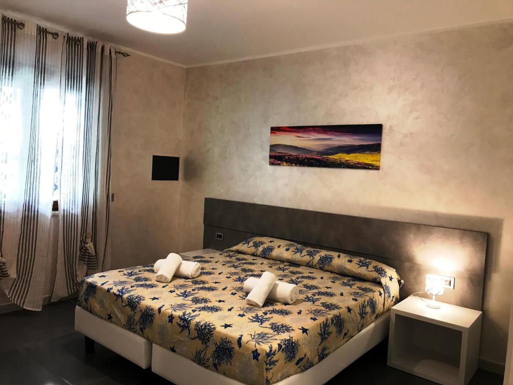 Postel nebo postele na pokoji v ubytování Hotel Village Eden