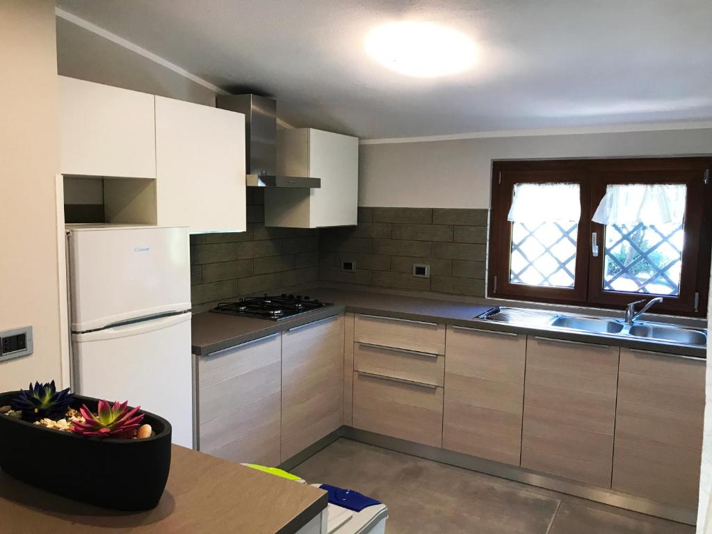 Kuchyň nebo kuchyňský kout v ubytování Hotel Village Eden