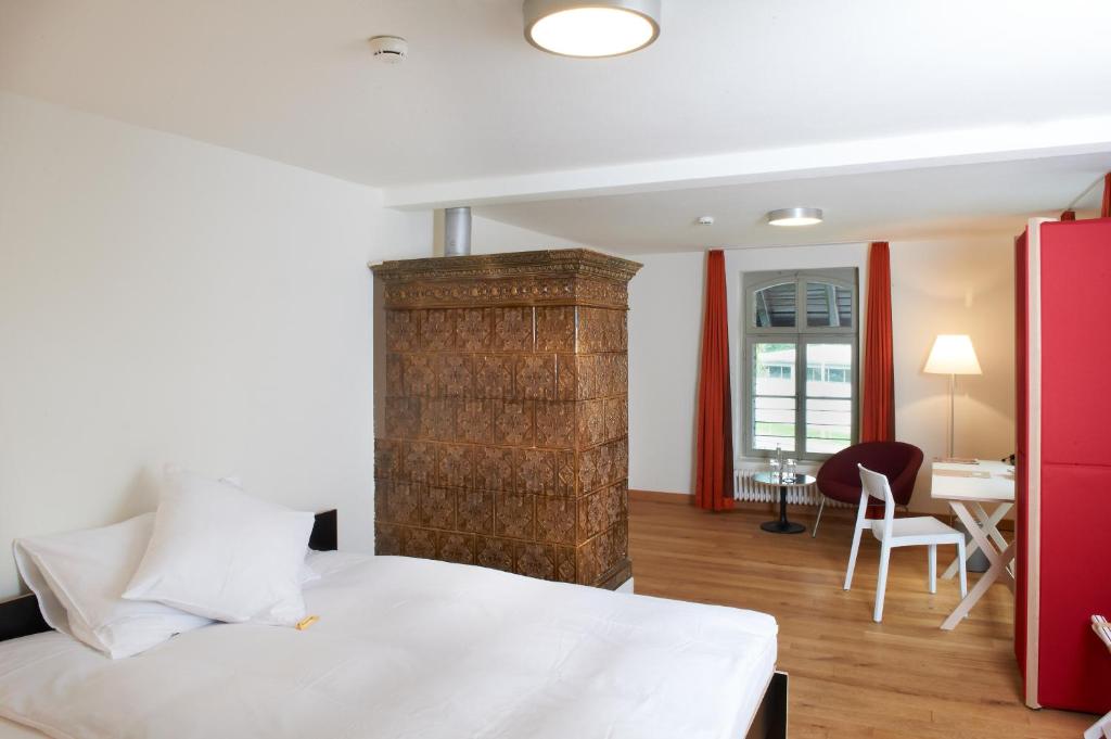 Postel nebo postele na pokoji v ubytování Boutique-Hotel Auberge Langenthal