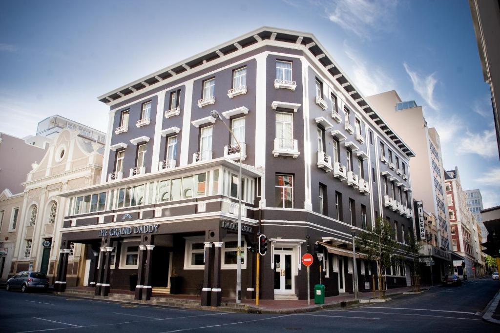 a large building on a city street with a street at Grand Daddy Boutique Hotel in Cape Town