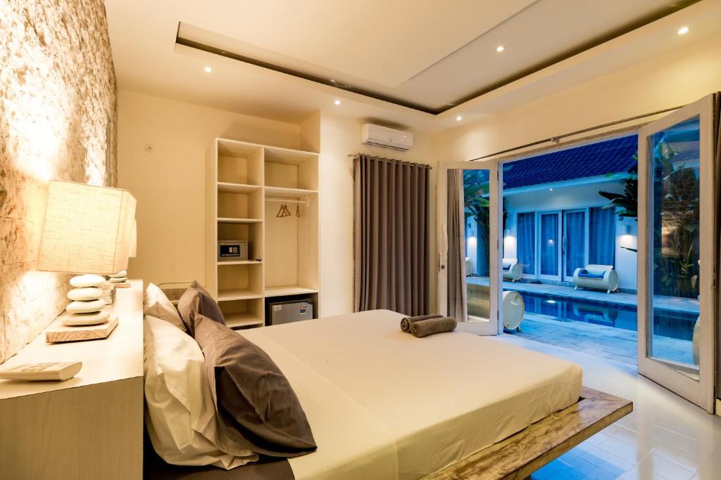 Postel nebo postele na pokoji v ubytování Tamoa Boutique Hotel