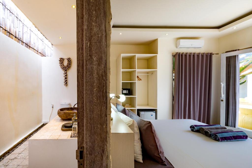 Postel nebo postele na pokoji v ubytování Tamoa Boutique Hotel