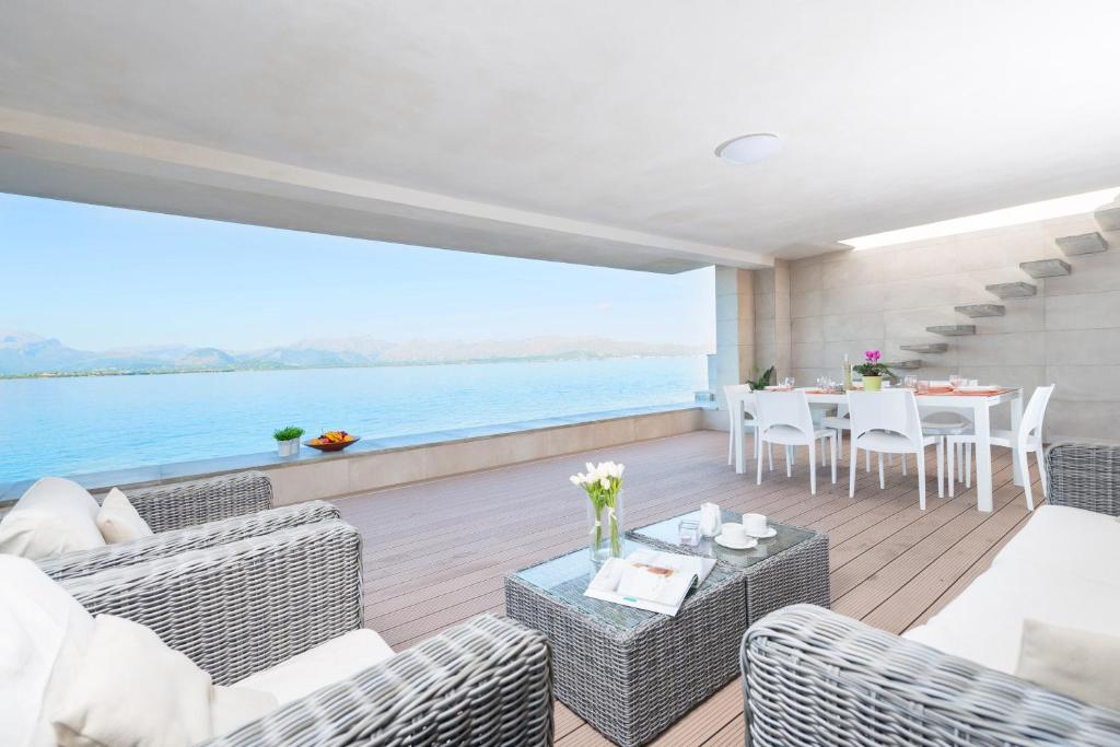 a living room with a view of the water at Aixa in Alcudia