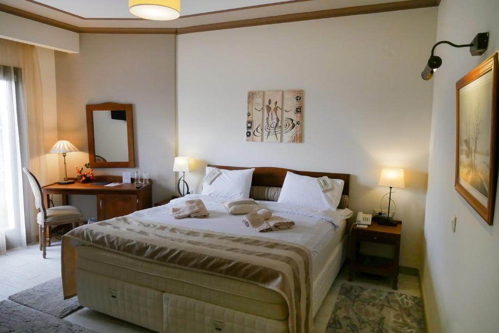 Postel nebo postele na pokoji v ubytování Hotel Rodovoli