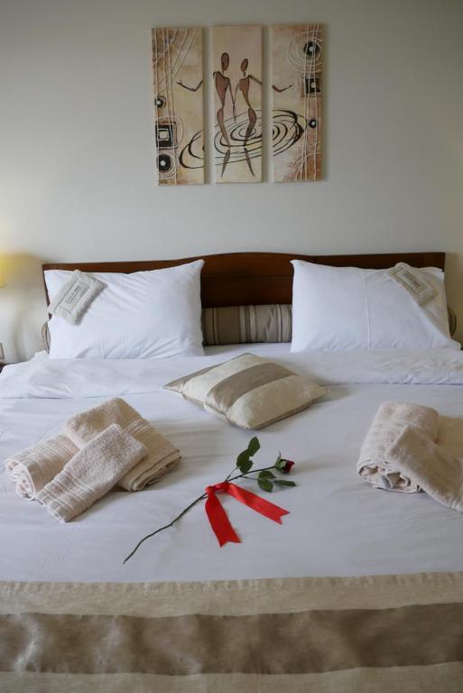 Postel nebo postele na pokoji v ubytování Hotel Rodovoli