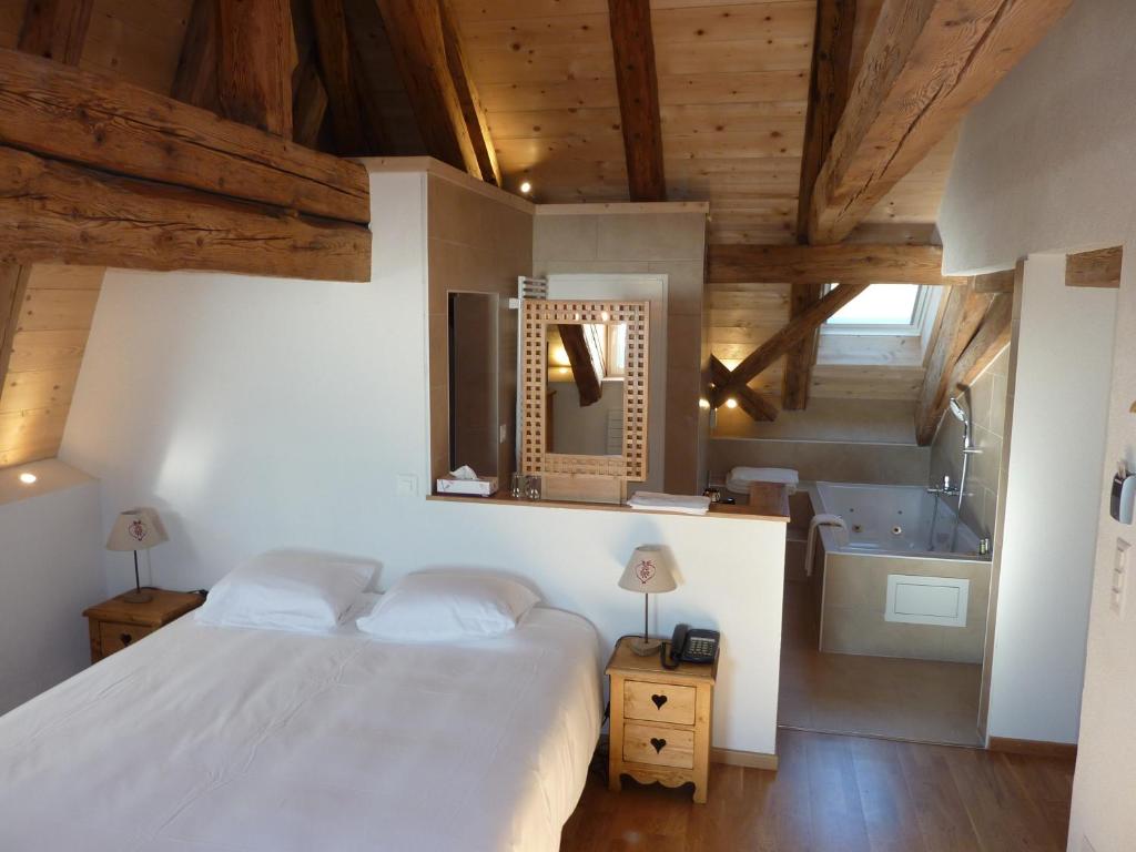 Postel nebo postele na pokoji v ubytování Petit Hôtel de Chaumont
