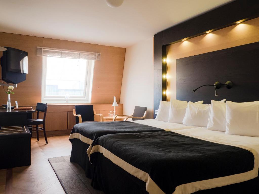 Postel nebo postele na pokoji v ubytování Hotel Lundia