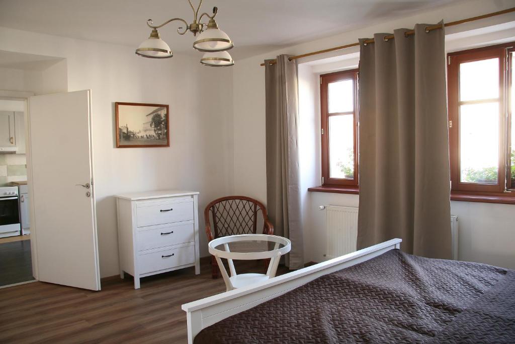 Postel nebo postele na pokoji v ubytování Penzion U Kapra