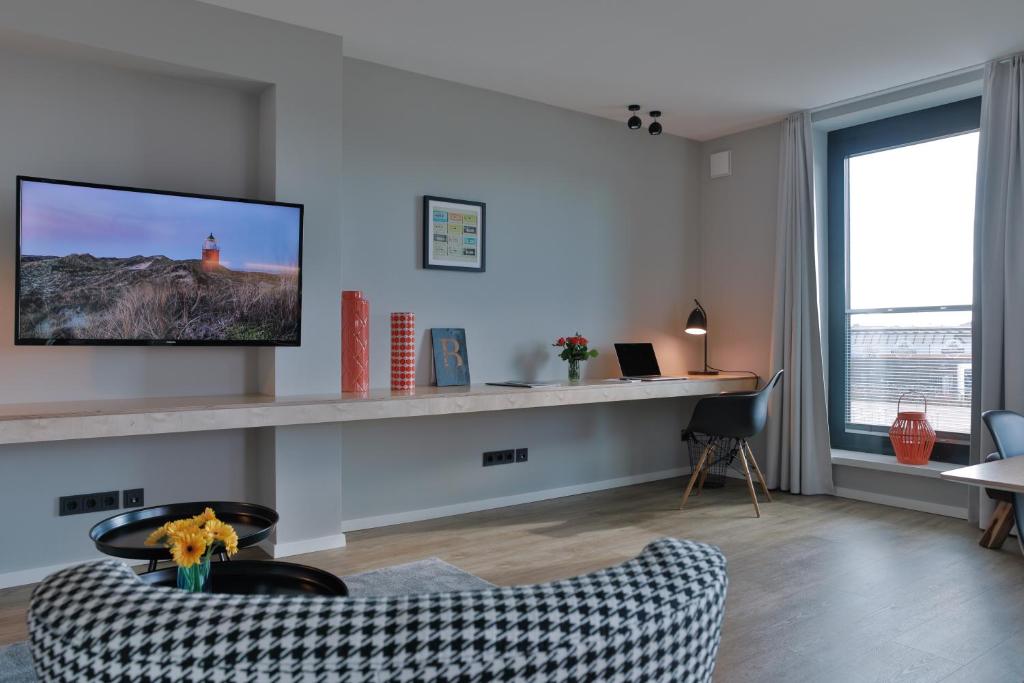 TV a/nebo společenská místnost v ubytování Bett&Bude Boardinghouse