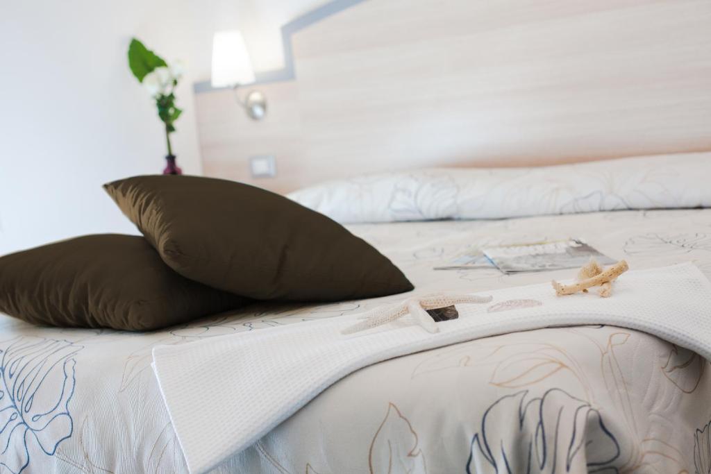 Postel nebo postele na pokoji v ubytování Hotel Beau Soleil