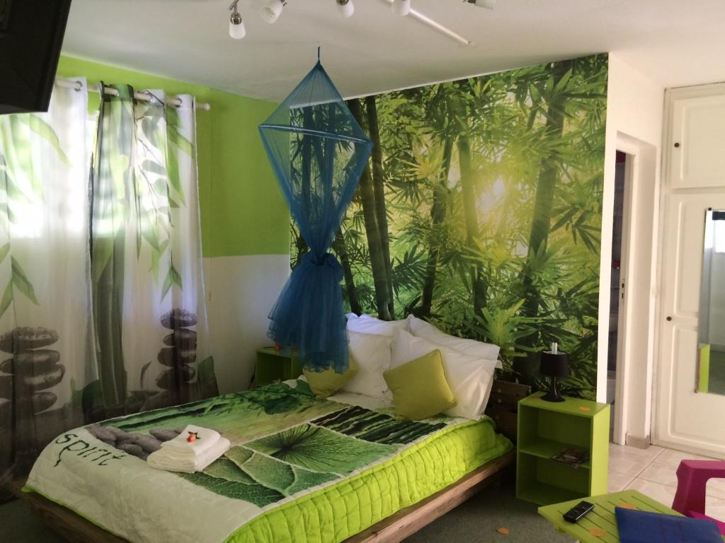 Postel nebo postele na pokoji v ubytování Location tropical
