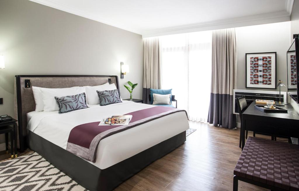 Postel nebo postele na pokoji v ubytování Avani Gaborone Resort & Casino